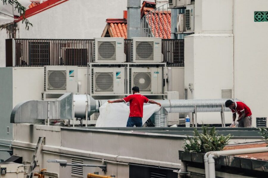 Technician servicing building equipment